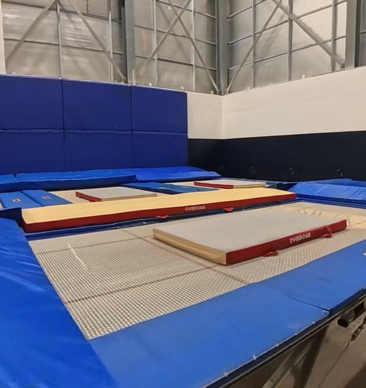 Our trampoline hall at Huddersfield Leisure Centre, with trampolines and soft landing mats ready to go